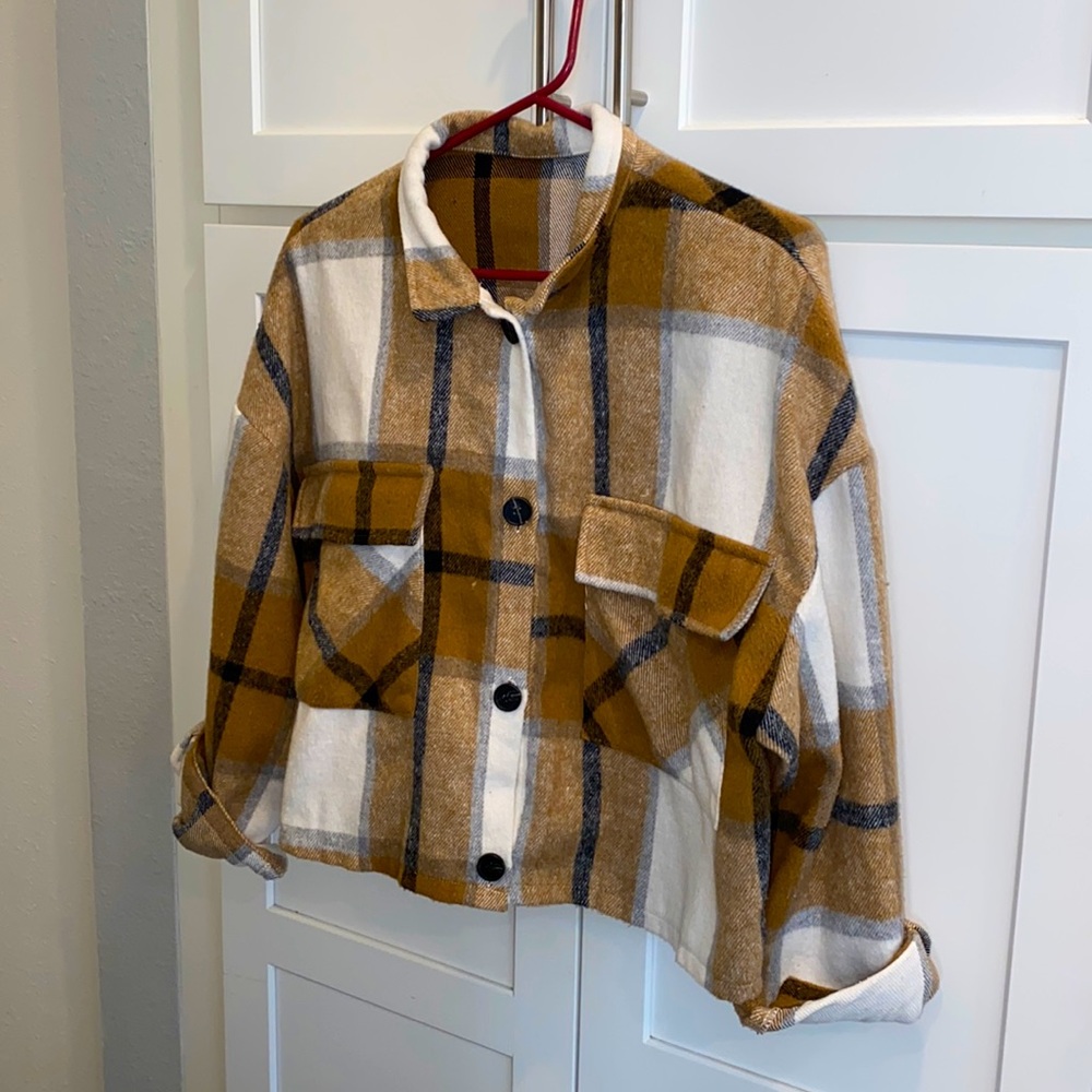 A cropped flannel/cardigan